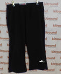 Front view of black Ronhill running trousers with reflective logo