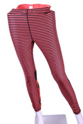 Front view of pink and black striped Roxy leggings with tropical print