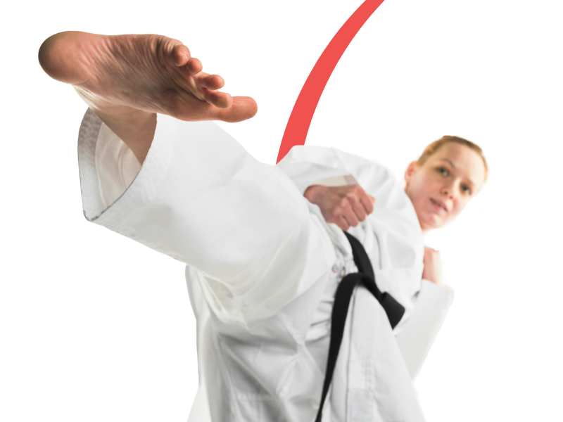Person in a white martial arts uniform with a black belt performing a kick on a white background