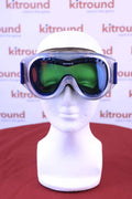 Front view of Serious ski and snowboard goggles with green-tinted lenses and blue strap on a mannequin head