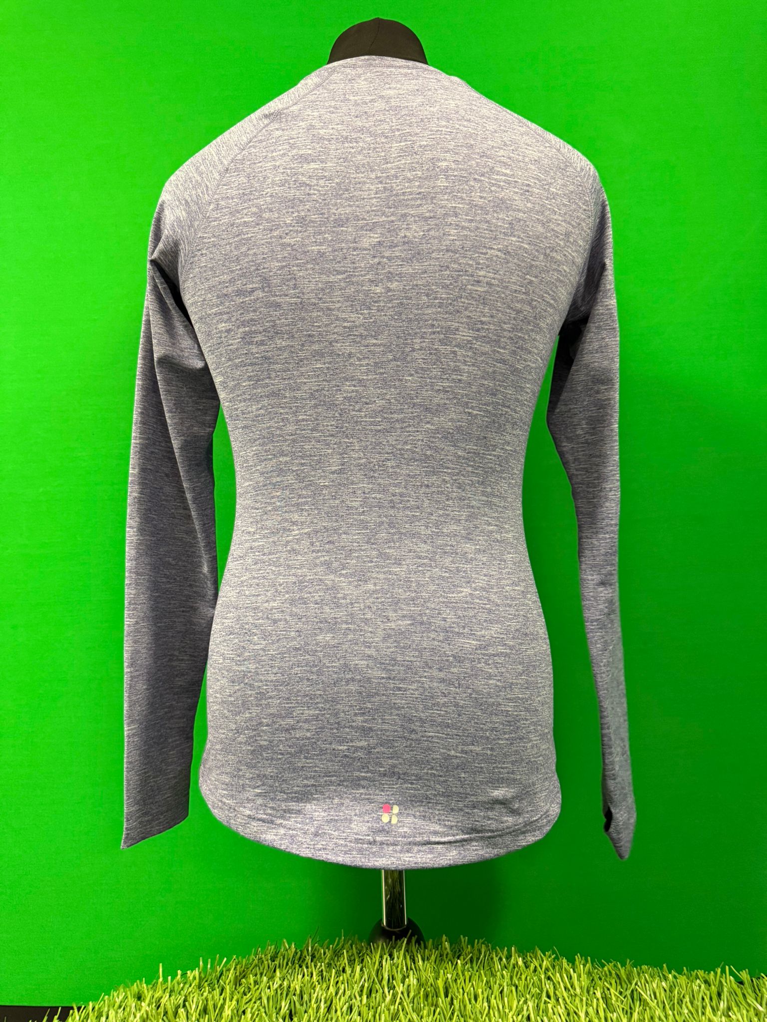 Back view of Sweaty Betty purple long sleeve top on mannequin