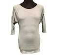 Front view of light green Sweaty Betty sports top with three-quarter sleeves