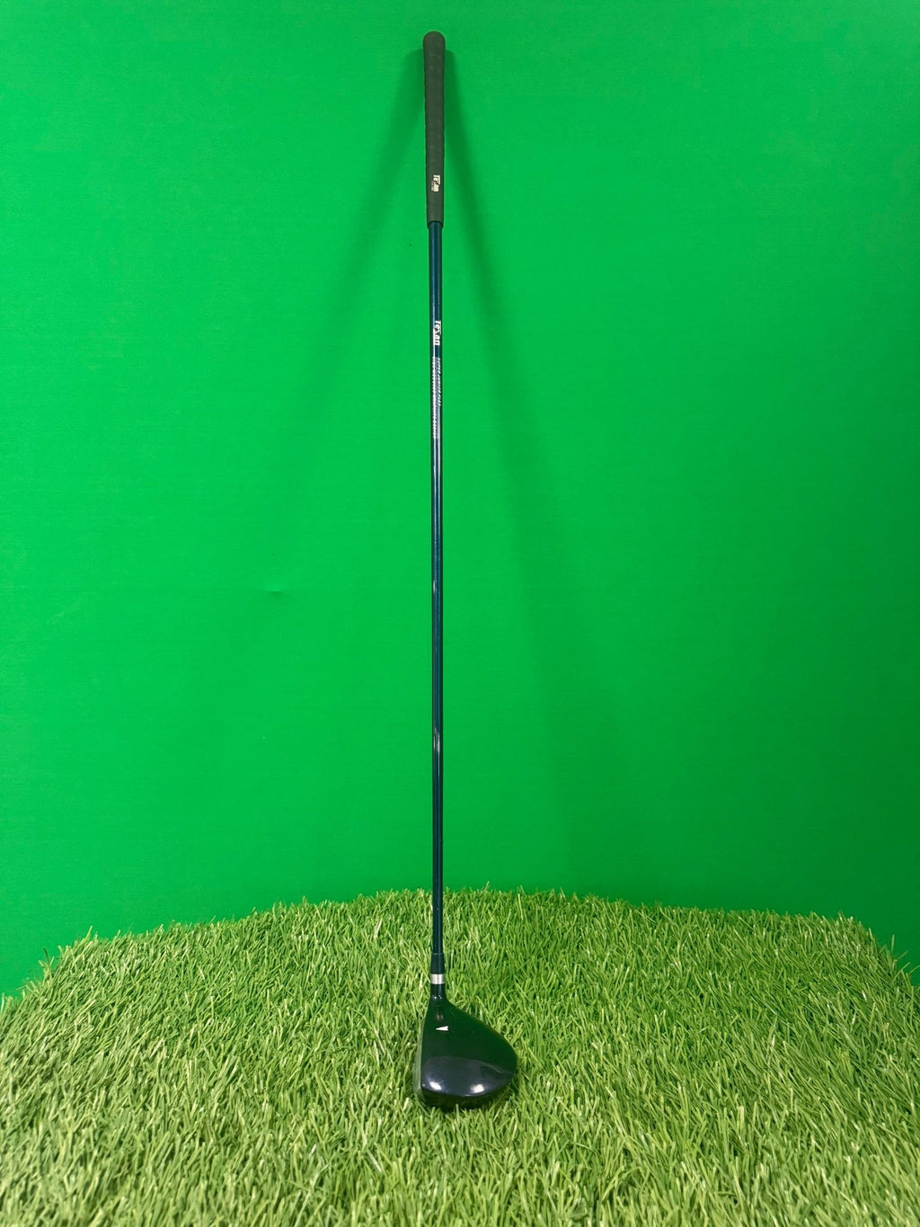 Texan Classics Junior 3 Wood left handed golf club standing on artificial grass