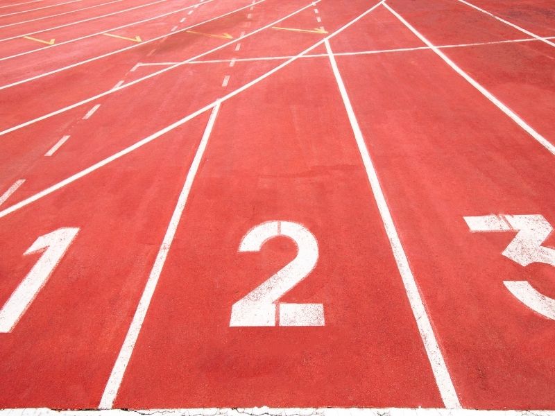 Red running track with white numbering