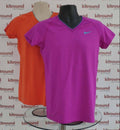Front view of Nike Pro Combat women's sports tops in orange and purple on mannequins