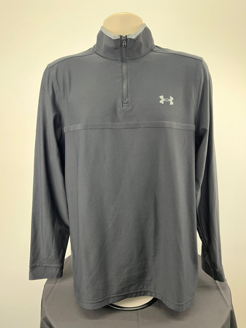 Front view of Under Armour black 1/4 zip golf top for men