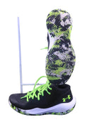 Side and sole view of black Under Armour Jet 21 basketball shoes with neon green laces and patterned outsoles
