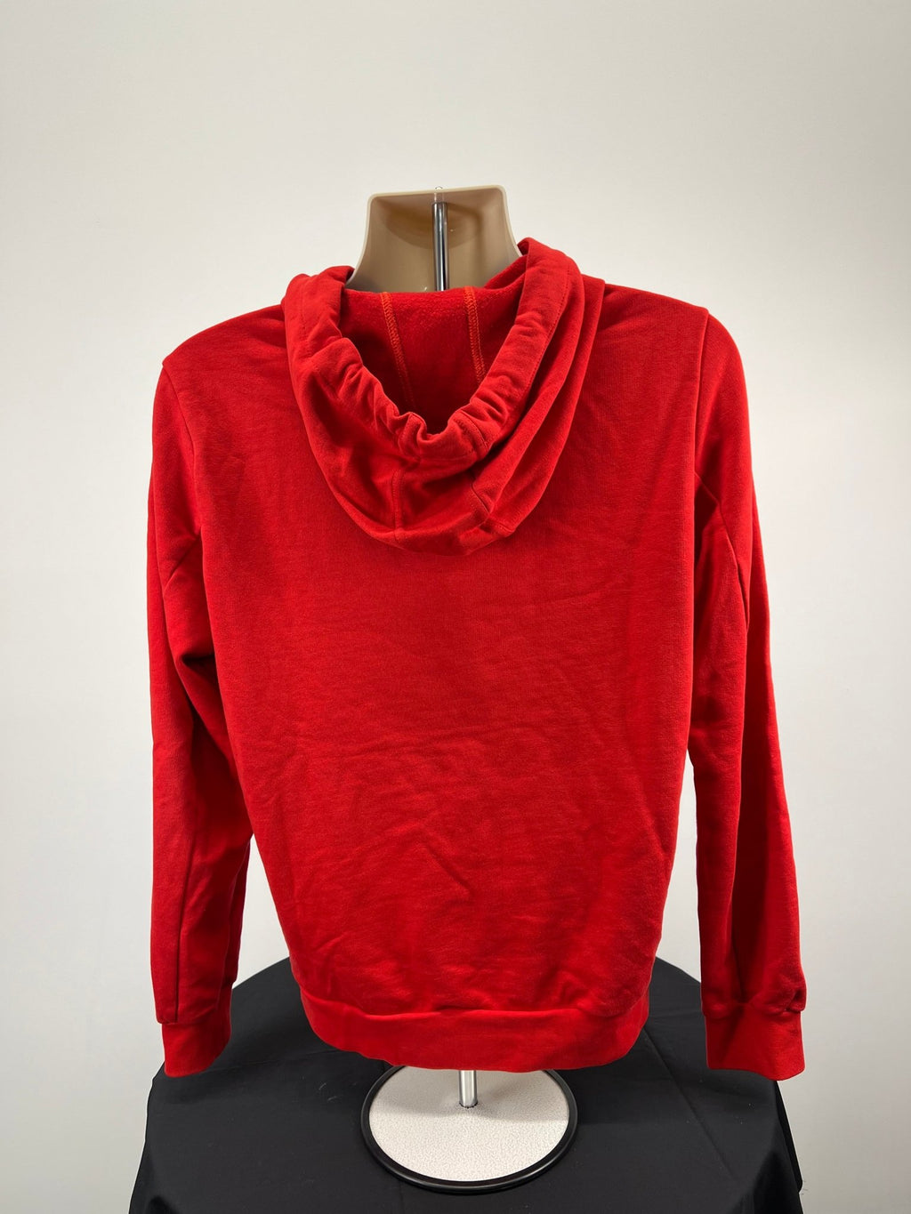 Back view of plain red Volleyball England hoodie showing hood and ribbed cuffs