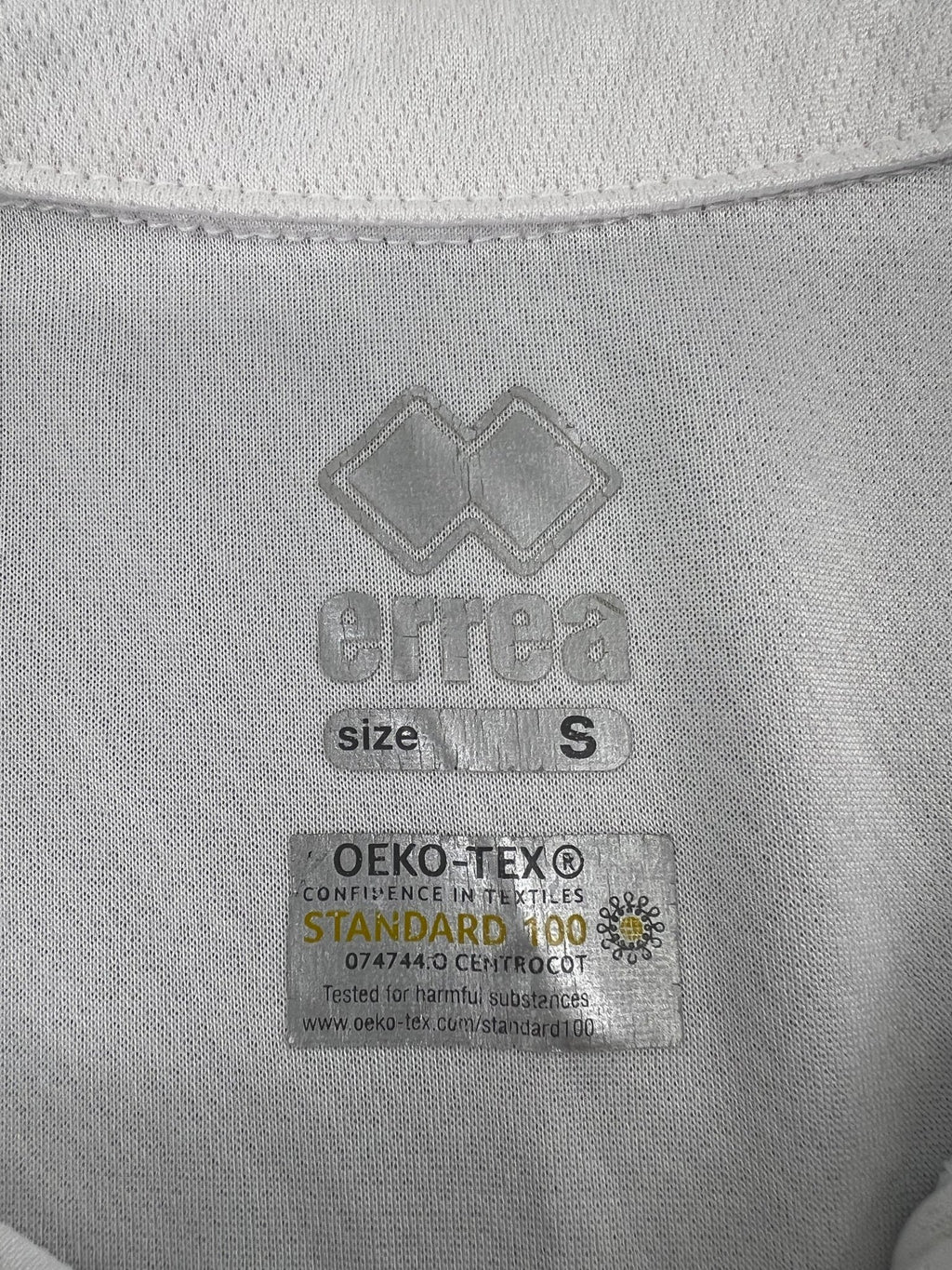 Close-up of Erreà and OEKO-TEX Standard 100 label inside the shirt