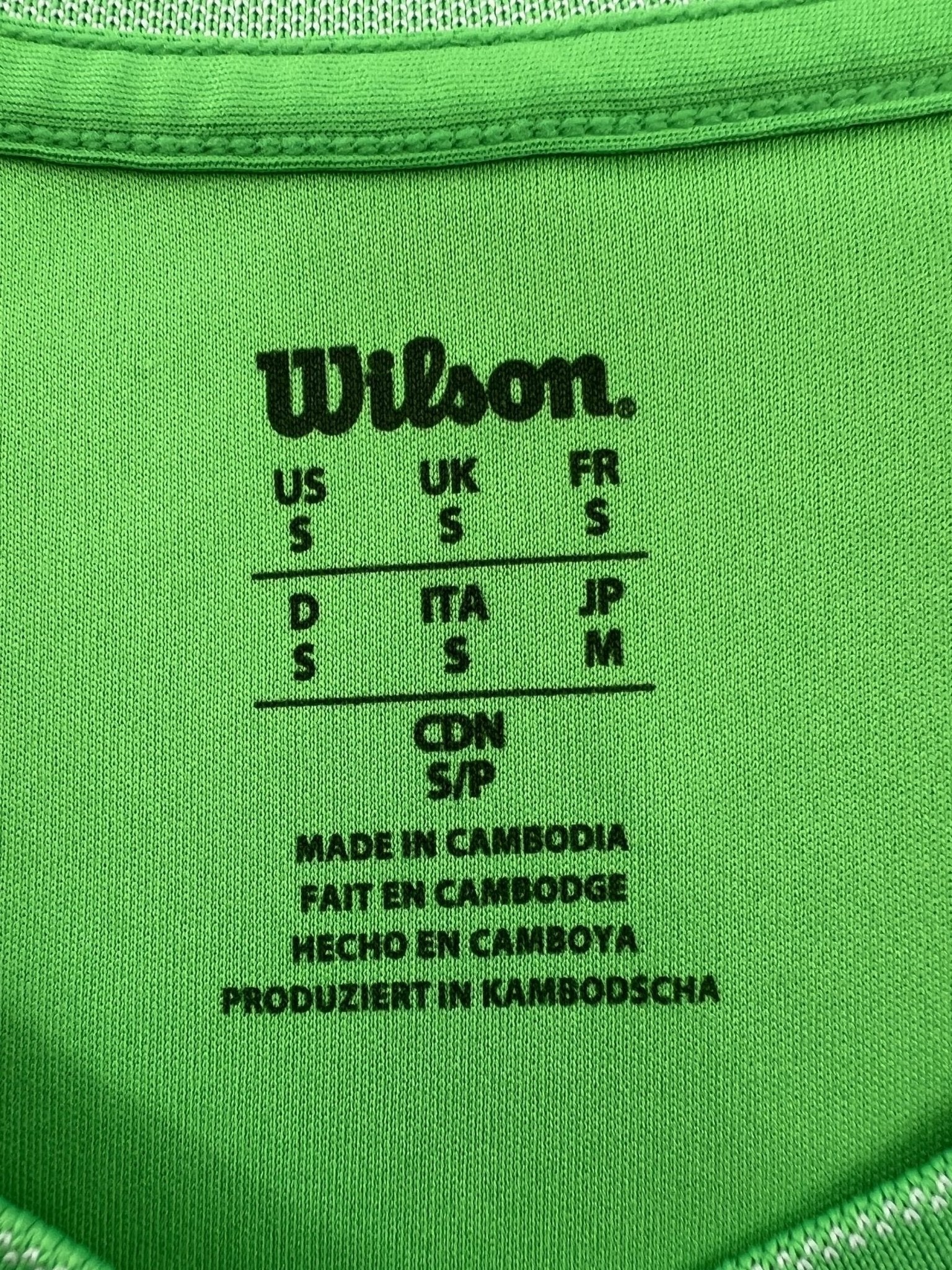 Wilson bright green V-neck sports t-shirt for women, size S. Made from breathable fabric for active wear.