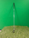 Wilson Prostaff oversize 4 iron golf club photographed on artificial grass with a green background