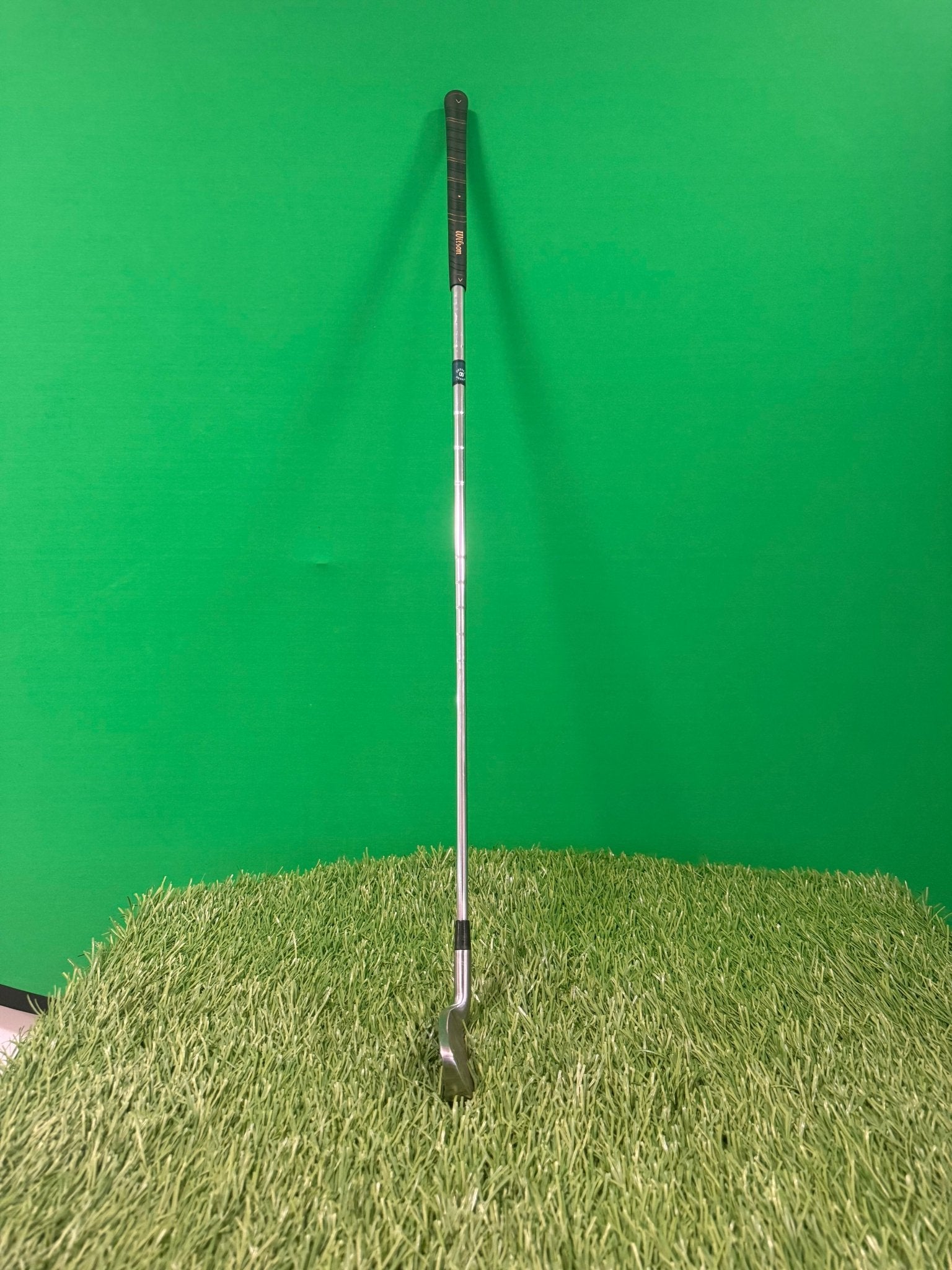 Wilson Prostaff oversize 4 iron golf club photographed on artificial grass with a green background