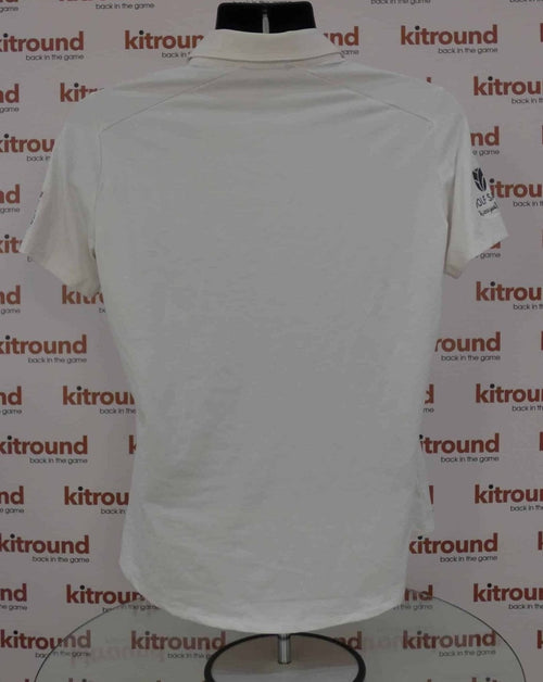 Back view of white adidas golf polo shirt displayed on a mannequin