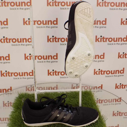Side and sole view of black adidas track running spikes with mesh upper and spike locations visible