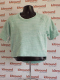adidas women's green short sleeve sports top displayed on mannequin