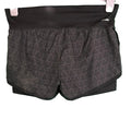 adidas black perforated sports shorts with inner layer displayed on hanger