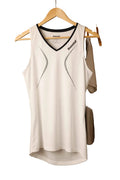 Front view of white Babolat sports vest with black trim on hanger