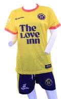 Front of Banana FC yellow football shirt and blue shorts by GripActive