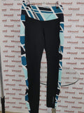 Front view of Brooks sports leggings with black base and blue, white geometric print side panels