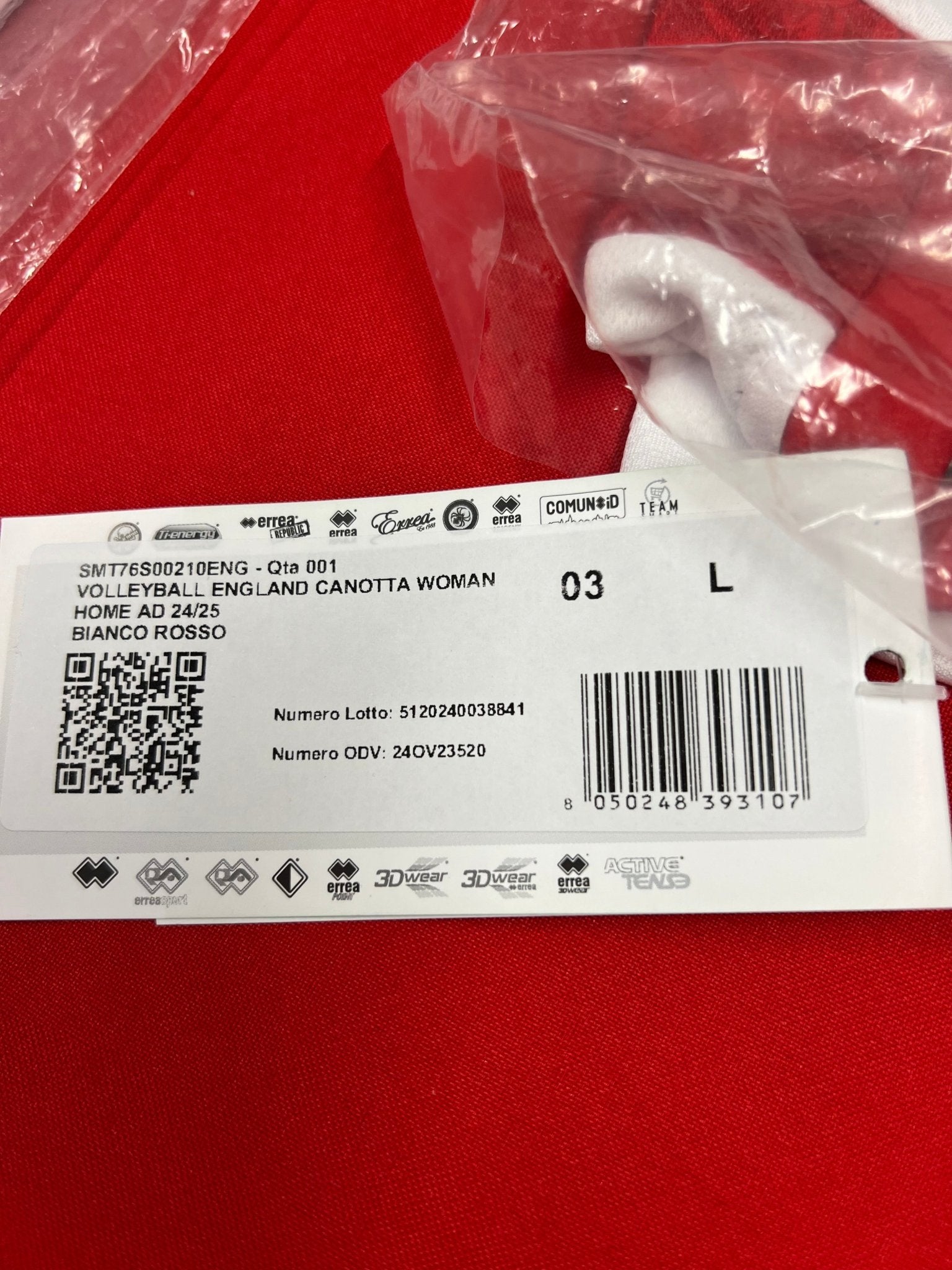 Close-up of product label showing volleyball England canotta woman home AD 24/25 size L