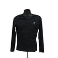 Front view of Karrimor women's black long sleeve running top with subtle pattern