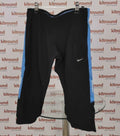 Front view of Nike Dri-FIT 3/4 running leggings with blue side stripes and white swoosh logo