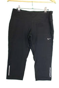 Front view of Nike Dri-FIT black 3/4 length running leggings size medium