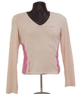 Front view of Nike pink long sleeve training top with V-neck and side panels