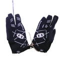 Front view of Seibertron black training gloves with white geometric pattern on artificial grass