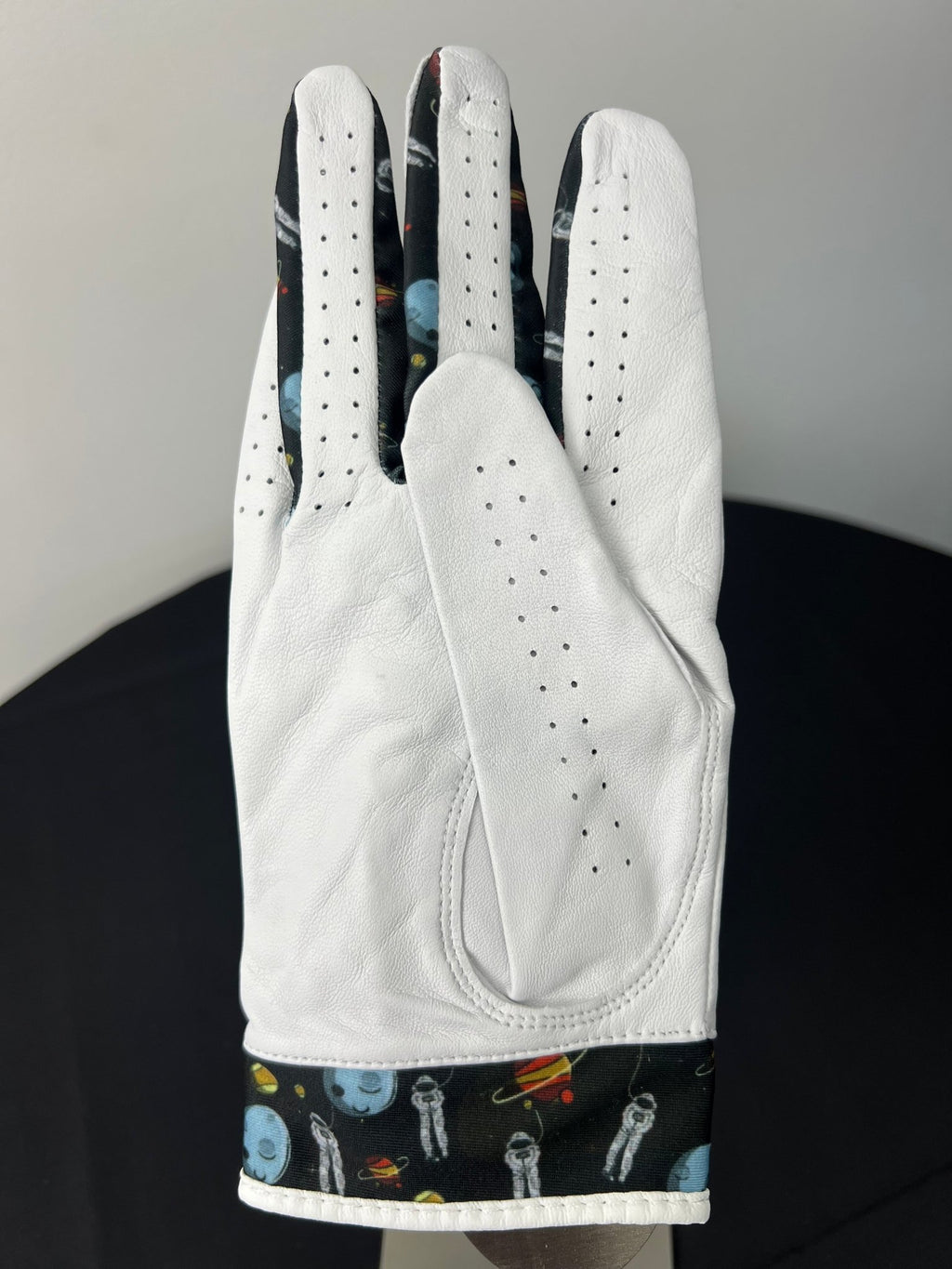 Back view of Women's Skins Golf Glove right hand with space themed print