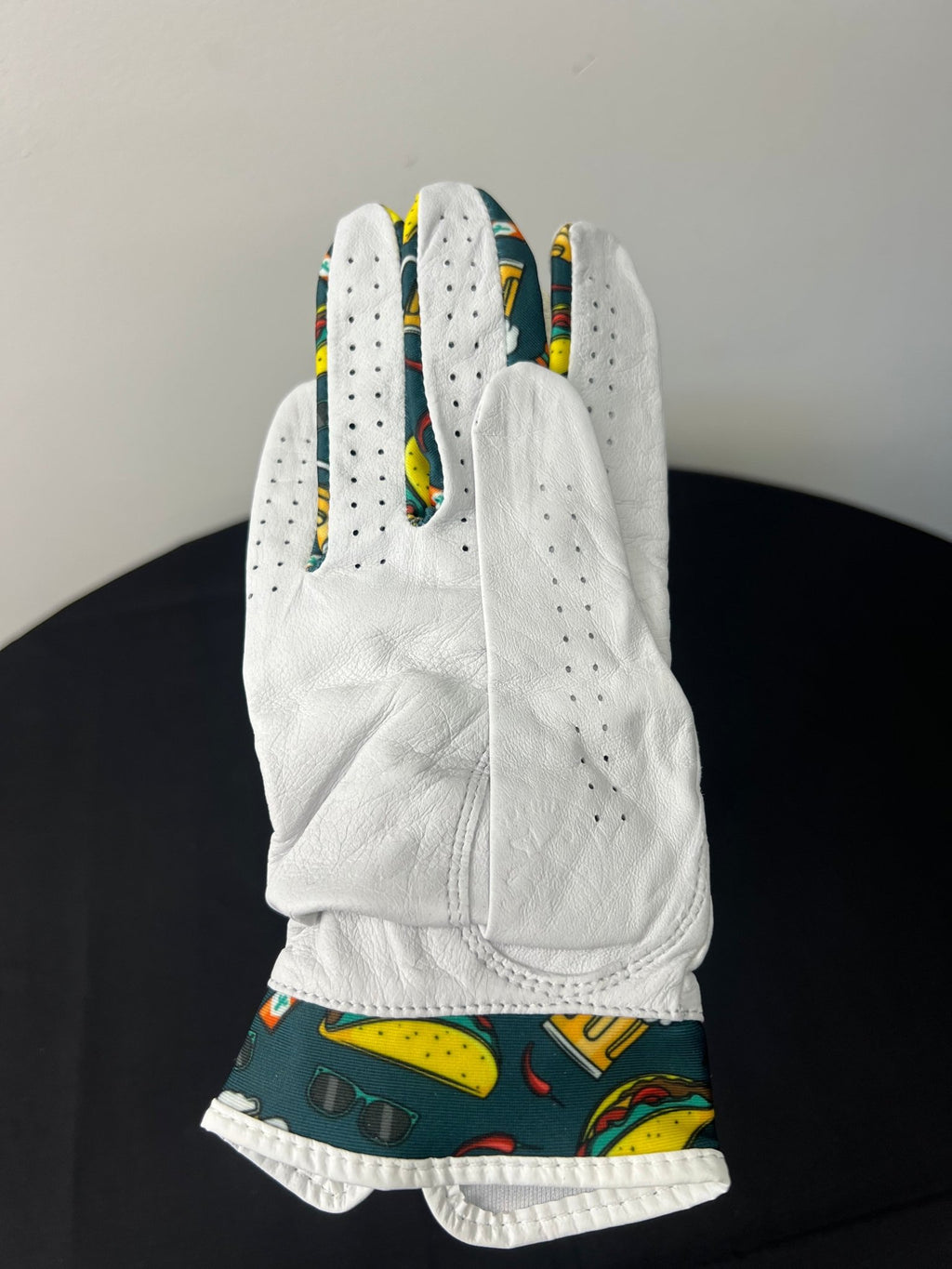 Women's golf glove with taco and beer motif, back side view