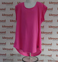 Front view of bright pink Under Armour sports top with mesh back, size medium, displayed on mannequin