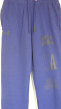 Under Armour blue tracksuit bottoms with branding and drawstring waist