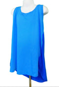 Front view of women's blue Under Armour sleeveless fitness vest on mannequin against green background