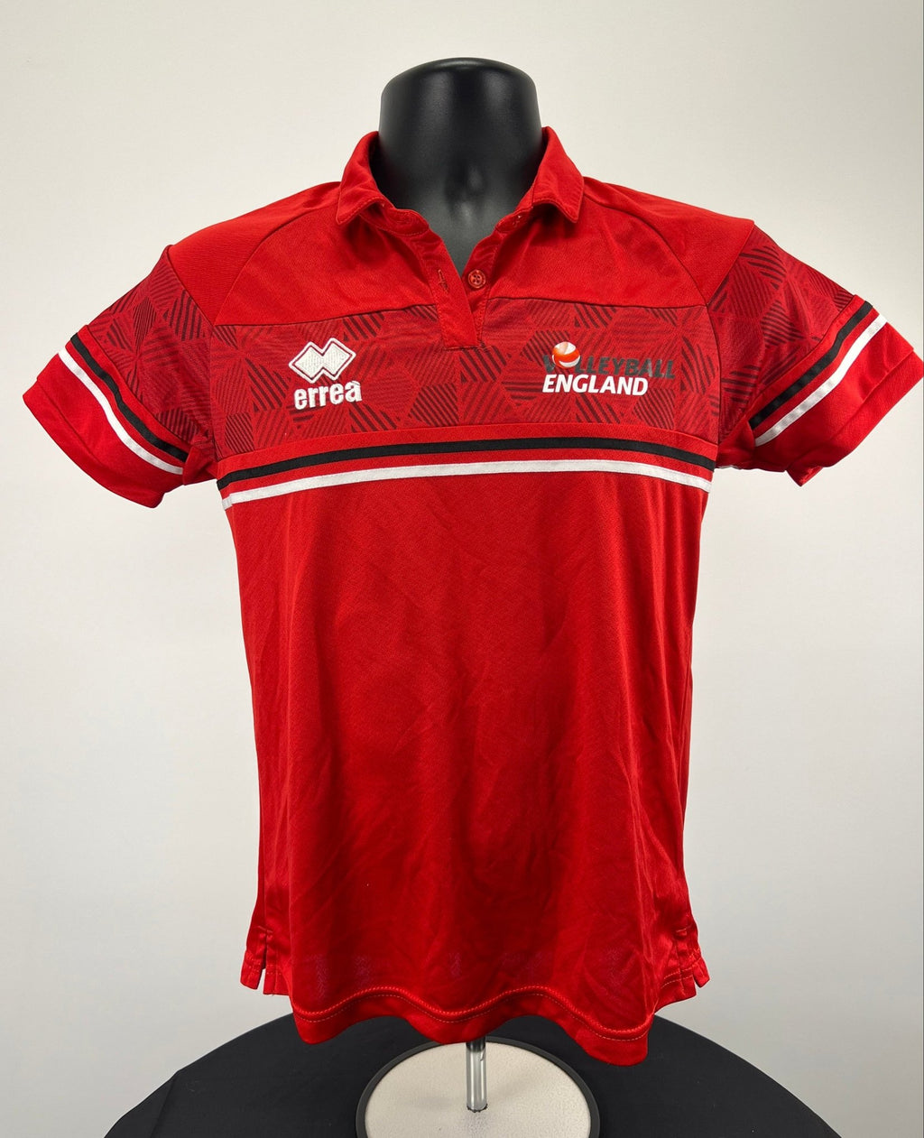 Front view of Women's Volleyball England red geometric polo shirt