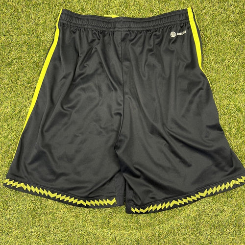 Back of Adidas Manchester United youth black shorts with yellow trim