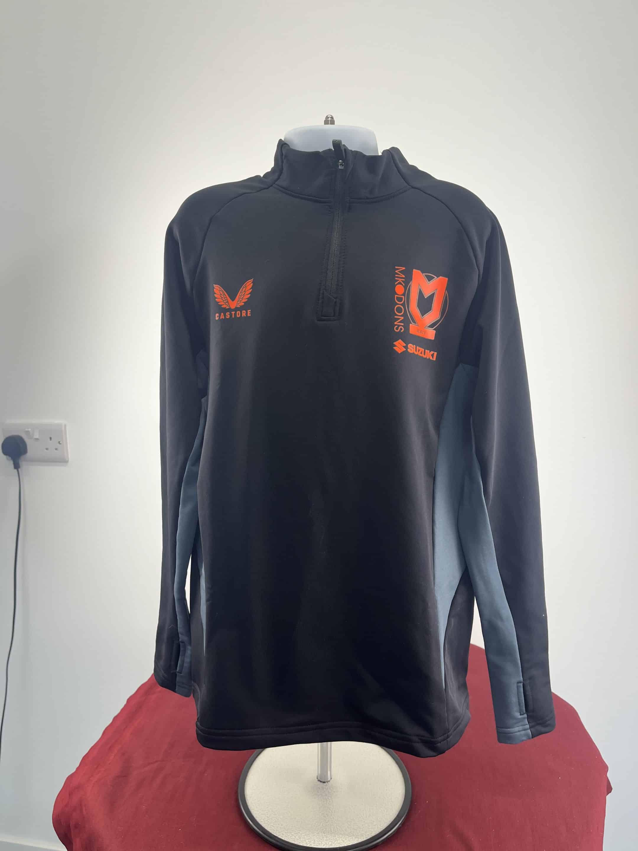 Youth’s Castore MK Dons Black Long Sleeve Sports Top Size M
